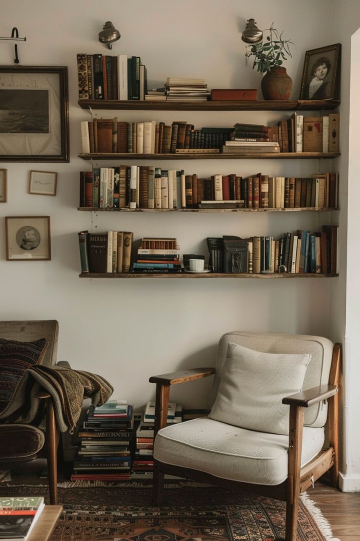 a living room filled with furniture and lots of books on the shelves in front of it