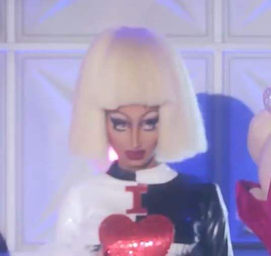 two barbie dolls are standing next to each other in front of a white wall with red and blue lights