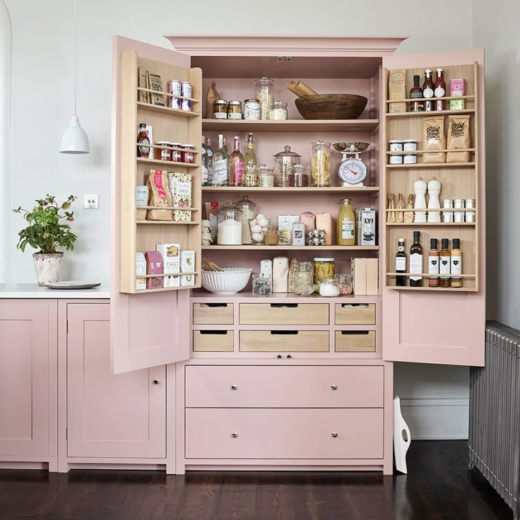 an open cabinet in the middle of a room