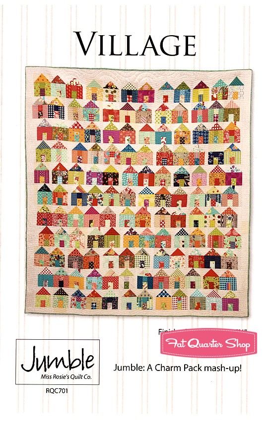 a quilt pattern with houses on it and the words village written in pink, blue, green