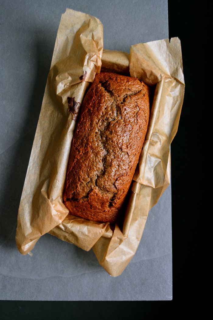 a loaf of banana bread in a brown paper bag