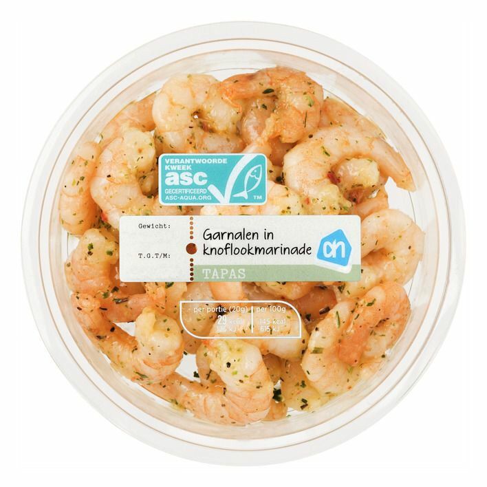 a plastic container filled with cooked shrimp