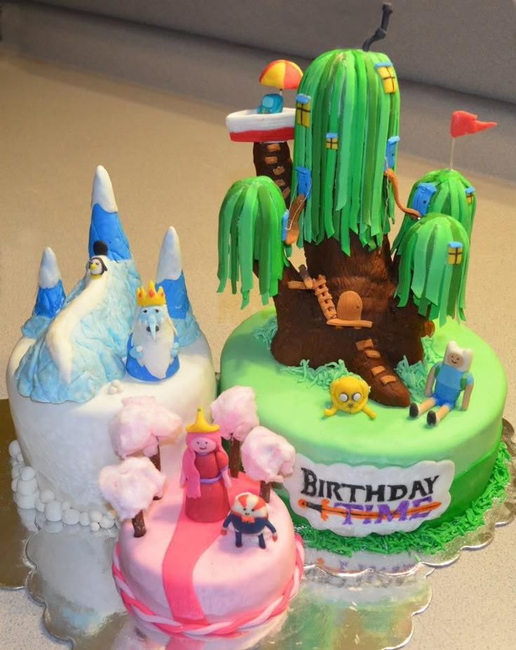 there are three cakes decorated to look like cartoon characters