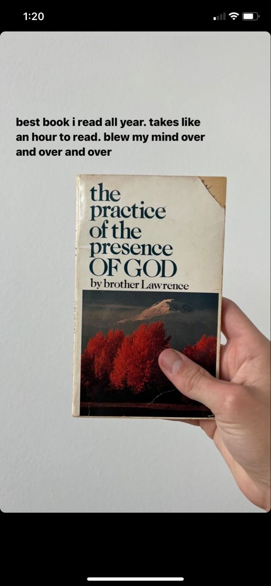 a person holding up a book in front of a white wall with the words, the practice of the lord