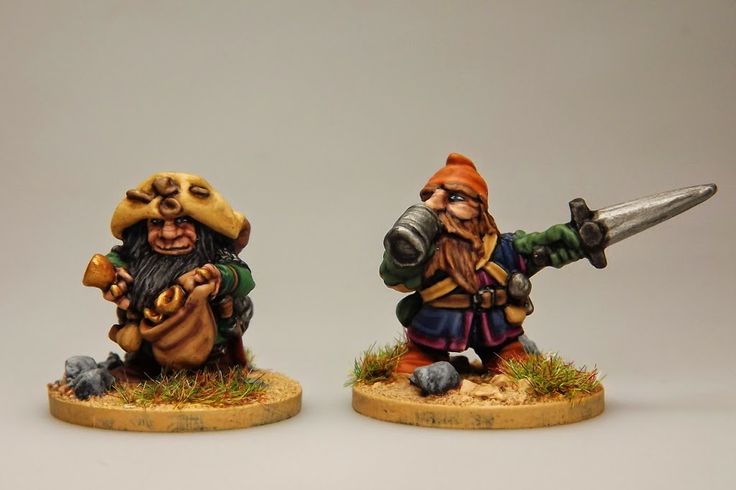 two gnome figurines are shown with one holding a knife