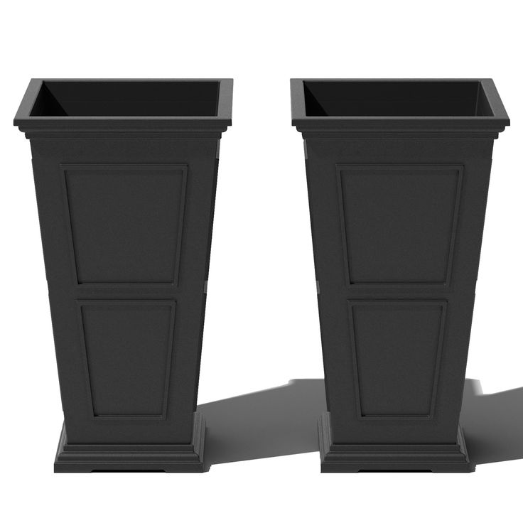 two black planters sitting next to each other