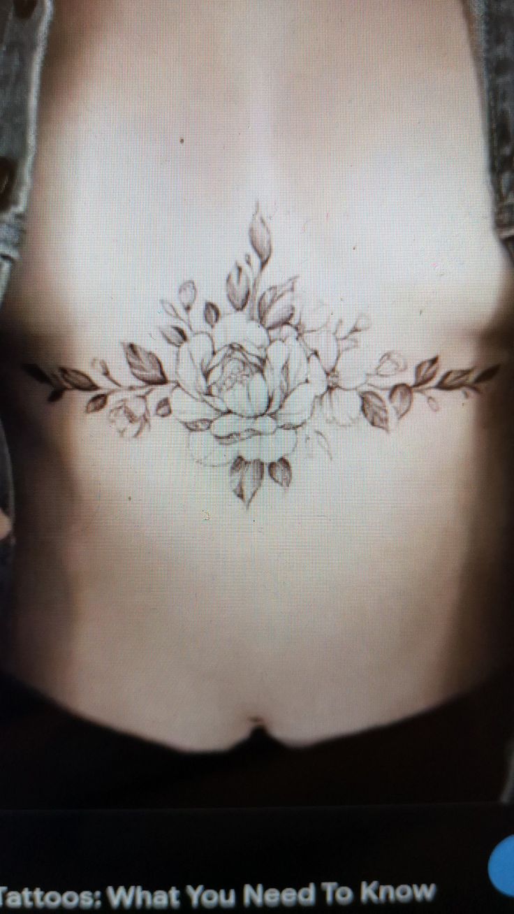 a woman's stomach with flowers on it and the words tattoos what you need to know