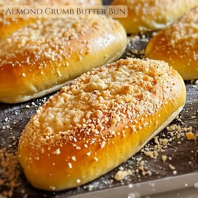 several breads sitting on top of a baking pan covered in sugar and sprinkles