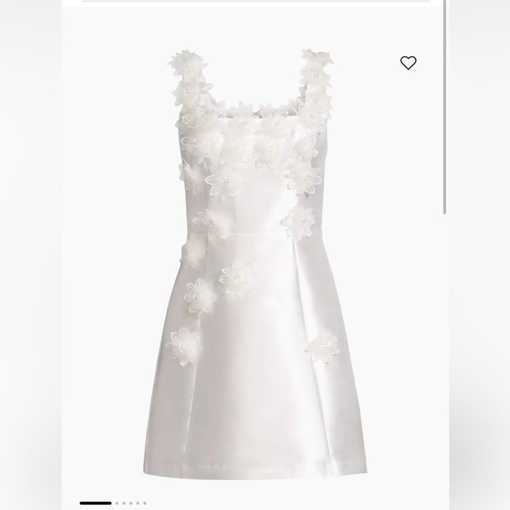 the dress is white and has flowers on it