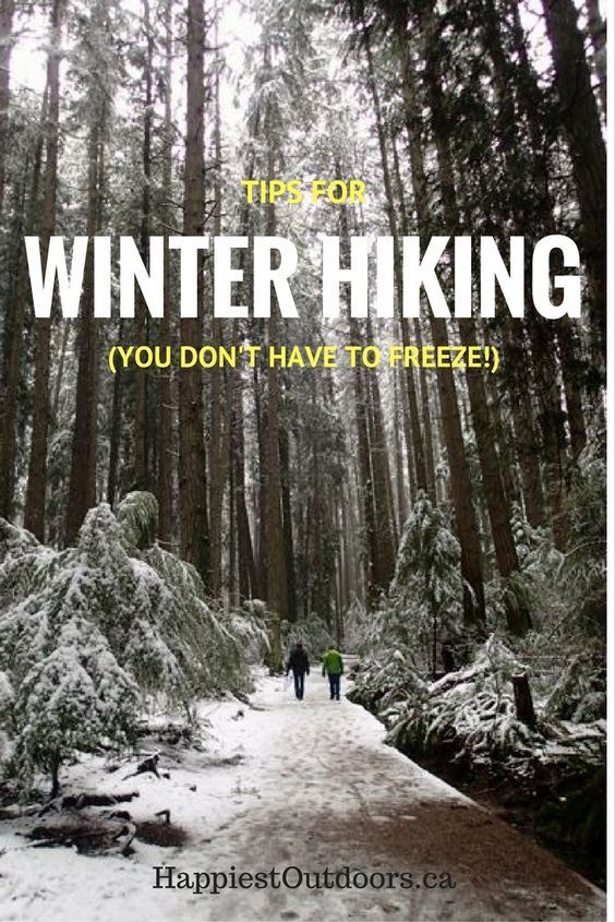 two people walking down a path in the woods with text overlay that reads tips for winter hiking you don't have to freeze