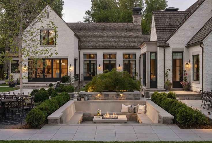 an outdoor living area with seating and tables