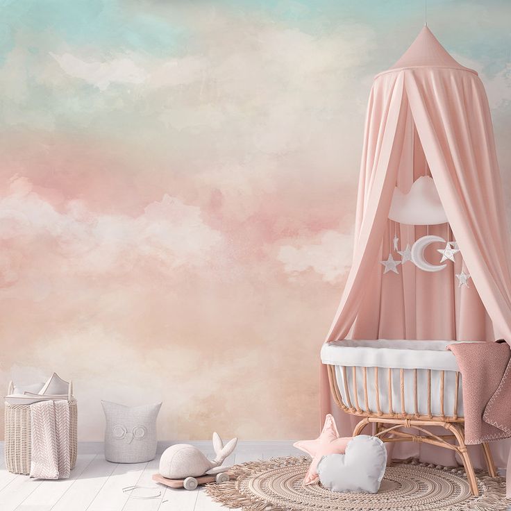 a baby's room decorated in pink and white