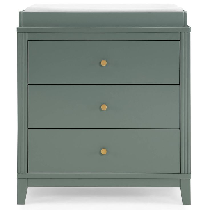 a green dresser with three drawers and two gold knobs on the bottom, against a white background