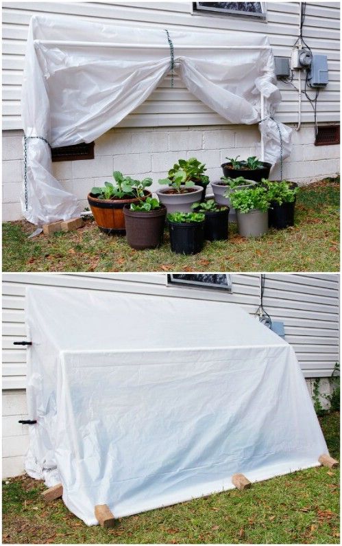 an outdoor garden with plastic covering over it