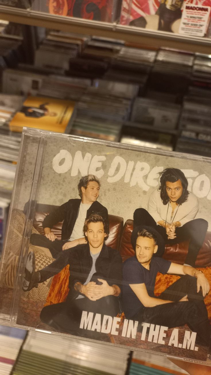 one direction made in the am cd is on display at a store with other cds