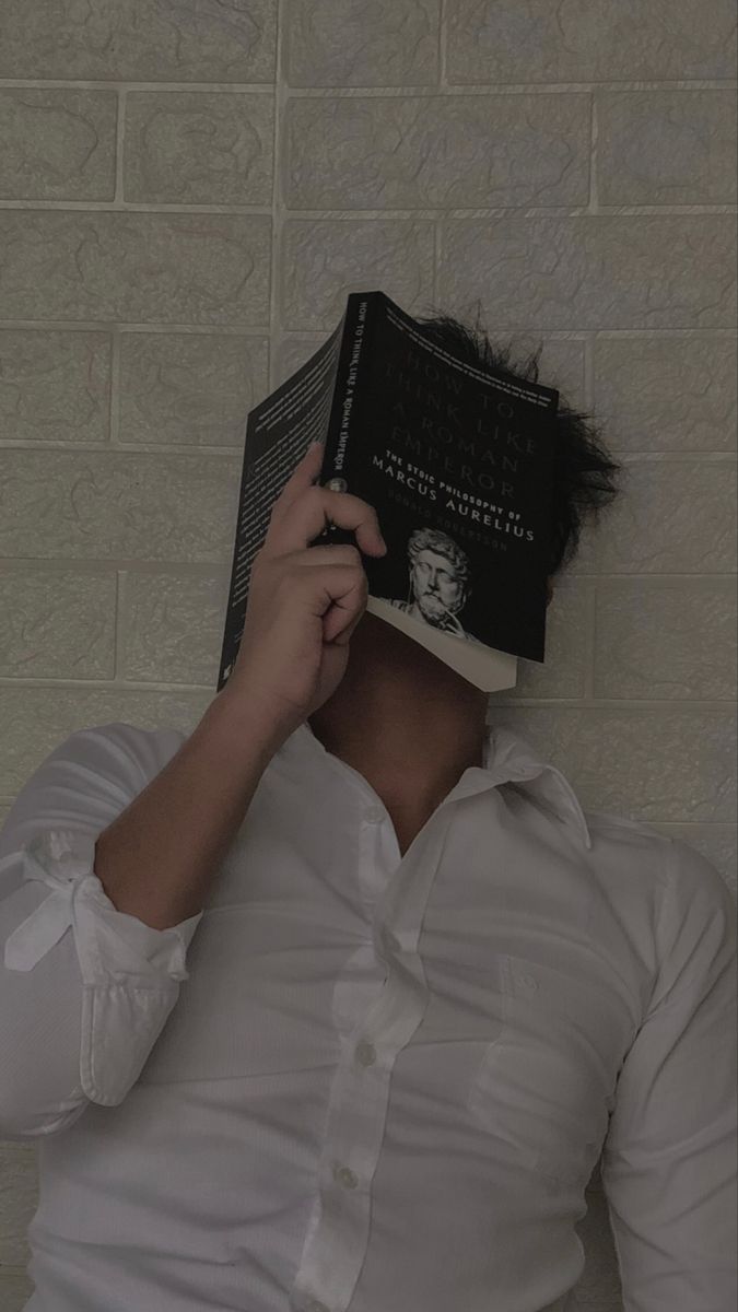 a person with a book on their head