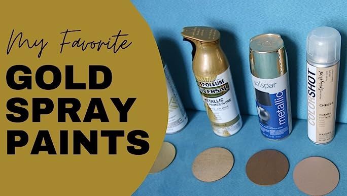 gold spray paint is on the table next to some other items