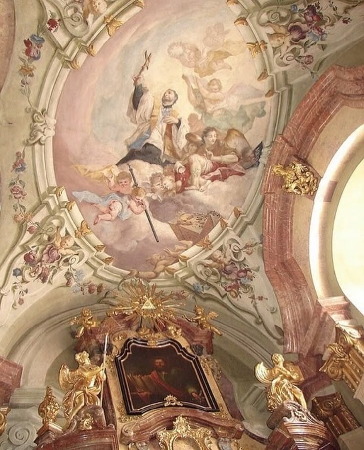 an ornate painted ceiling in a church