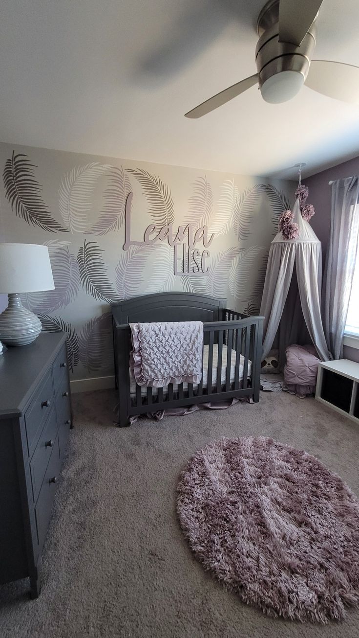 a baby's room with a crib, dresser and bed