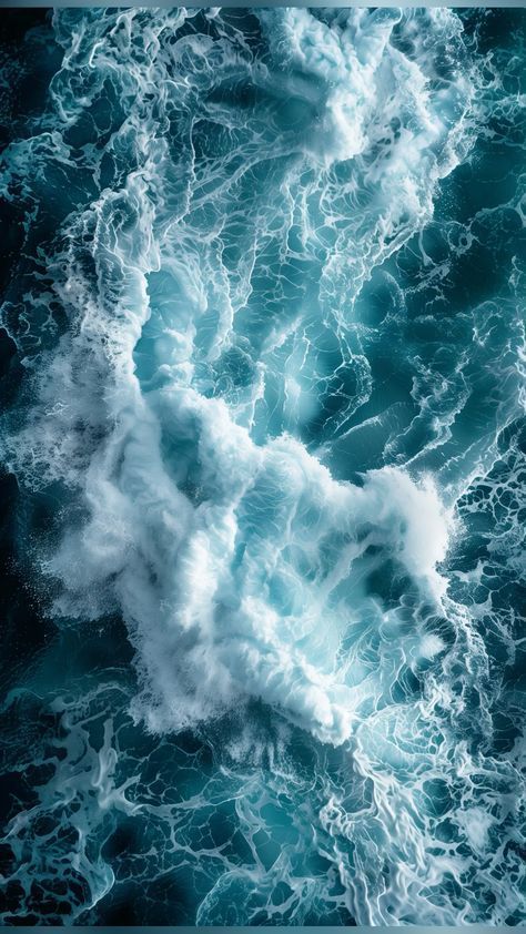 an aerial view of the ocean with waves and foamy blue water, taken from above