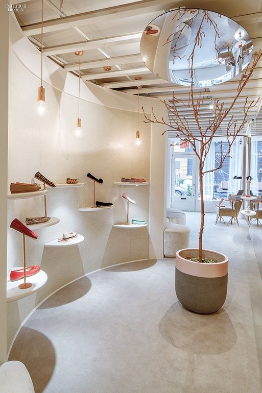 the interior of a shoe store with white walls