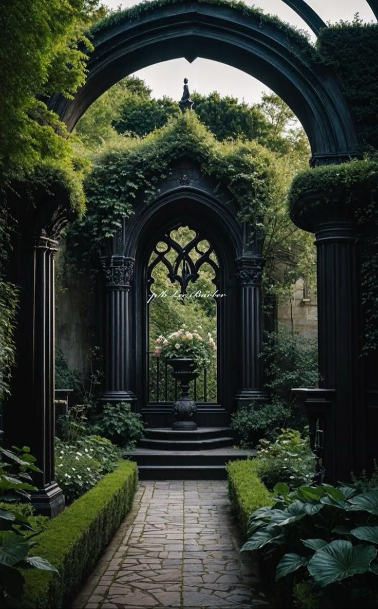 an archway in the middle of a lush green garden