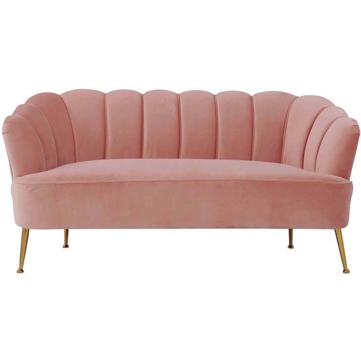 a pink velvet sofa with gold legs and an oval shaped backrest, on a white background