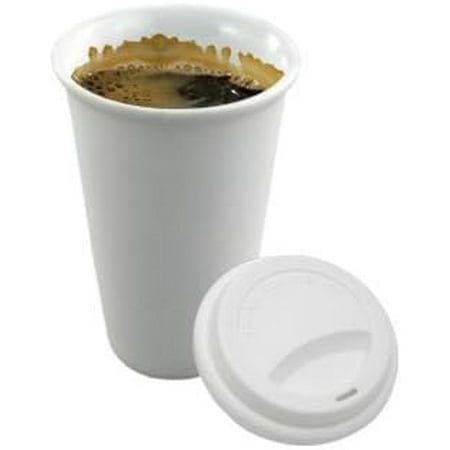 a white cup filled with liquid next to a lid