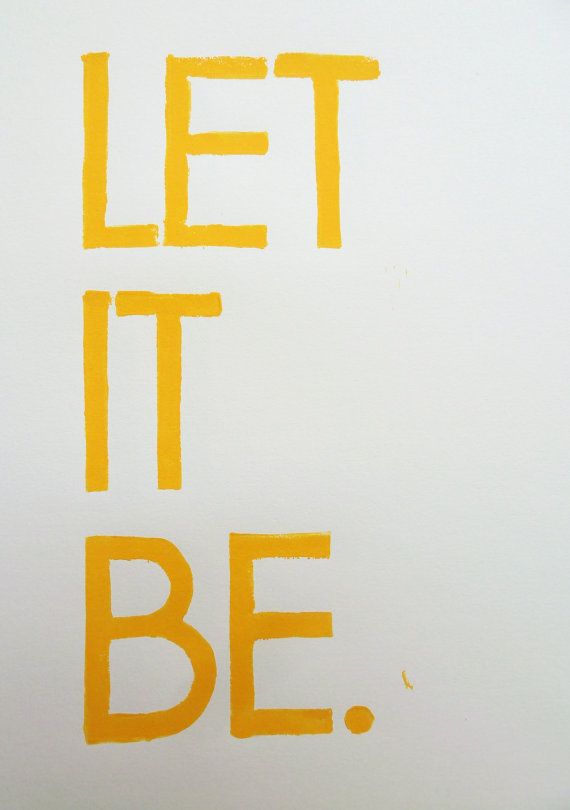 the words let it be written in yellow on a white background