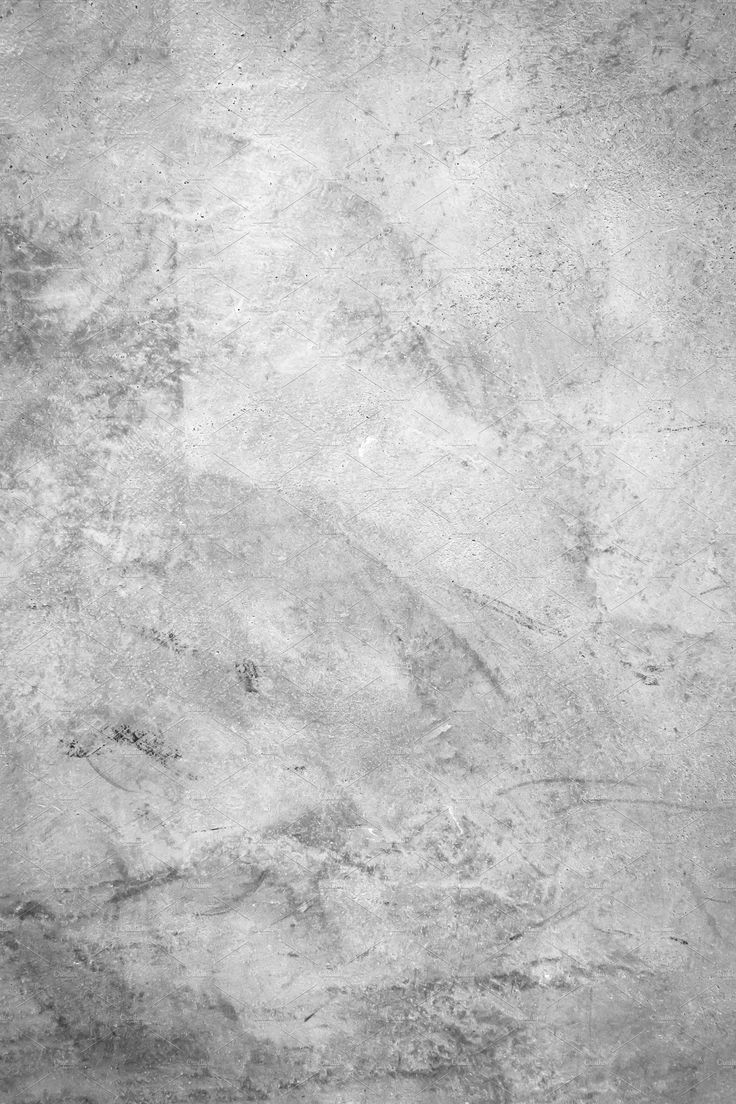 a black and white photo of the surface of a concrete wall with cracks in it