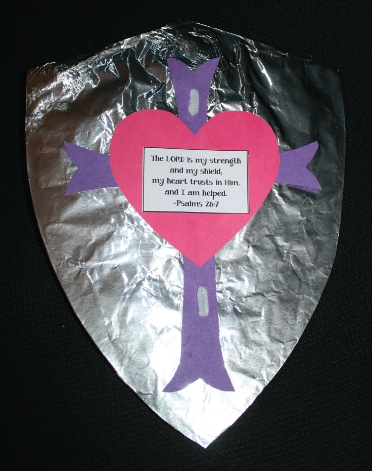 a piece of tin foil with a heart and cross on it that says, the lord is my strength