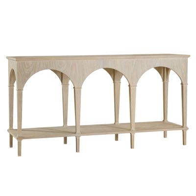 a wooden shelf with arches on the top