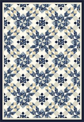 a blue and white quilt with an intricate design