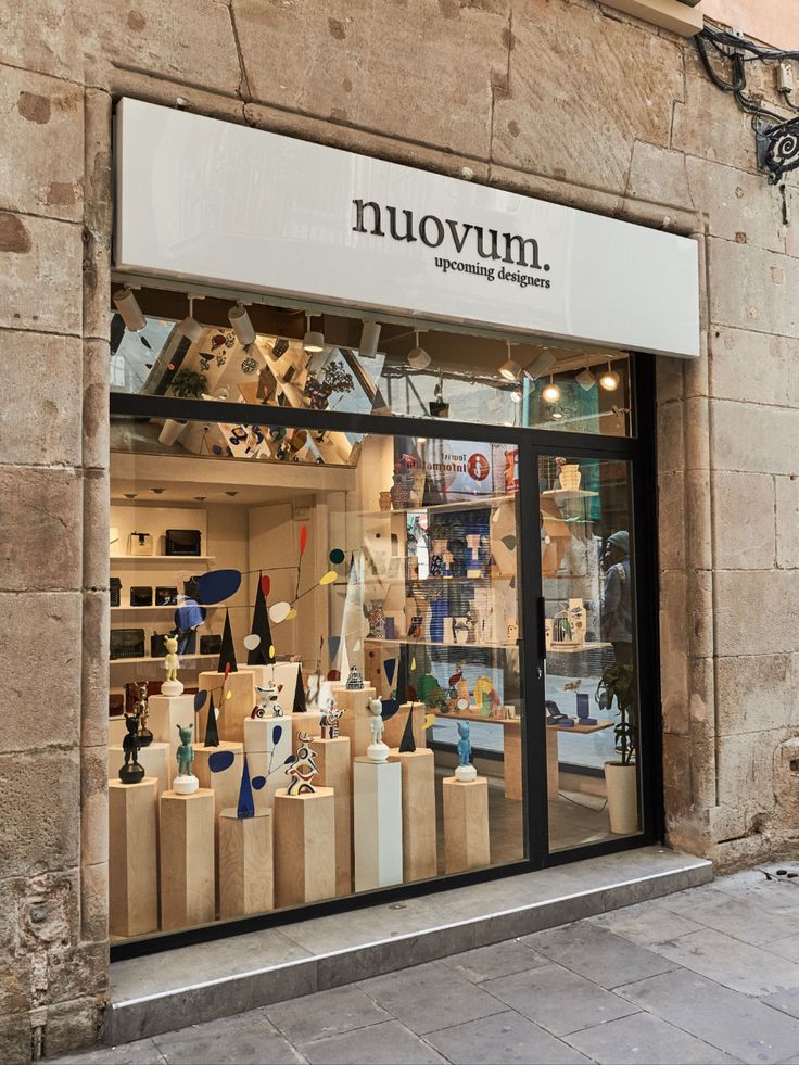 a store front with lots of vases on display