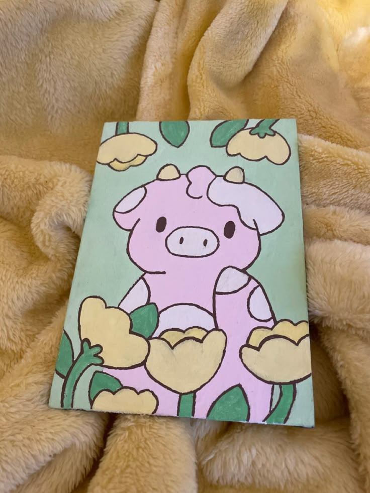 a painting of a pig sitting on top of a blanket