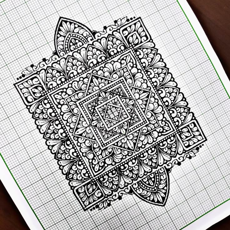 an intricately designed drawing on top of a piece of paper