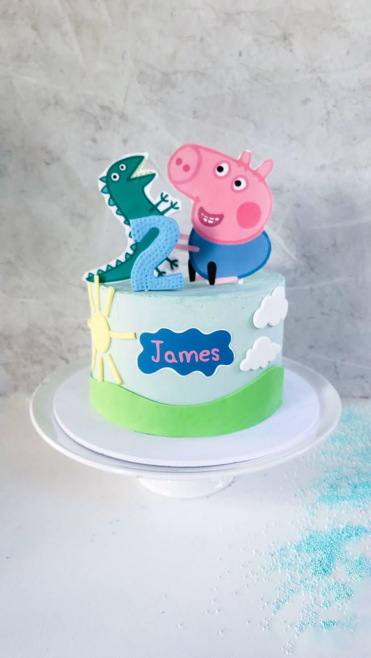 a peppa pig birthday cake with the name james on it