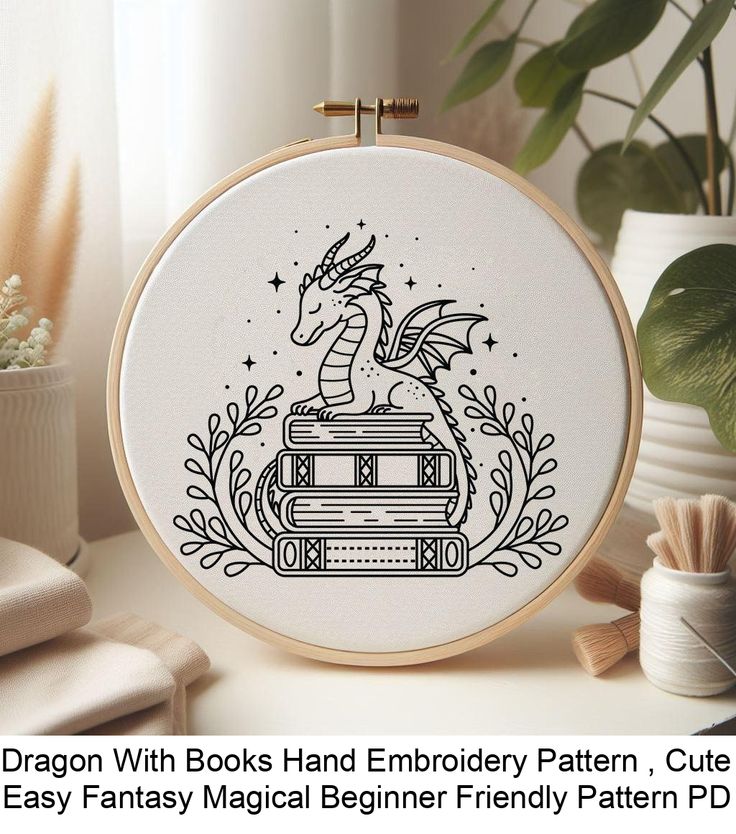 a cross stitch pattern with a dragon sitting on top of books and surrounded by plants