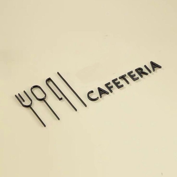 the word caferia written in black on a white surface with utensils next to it