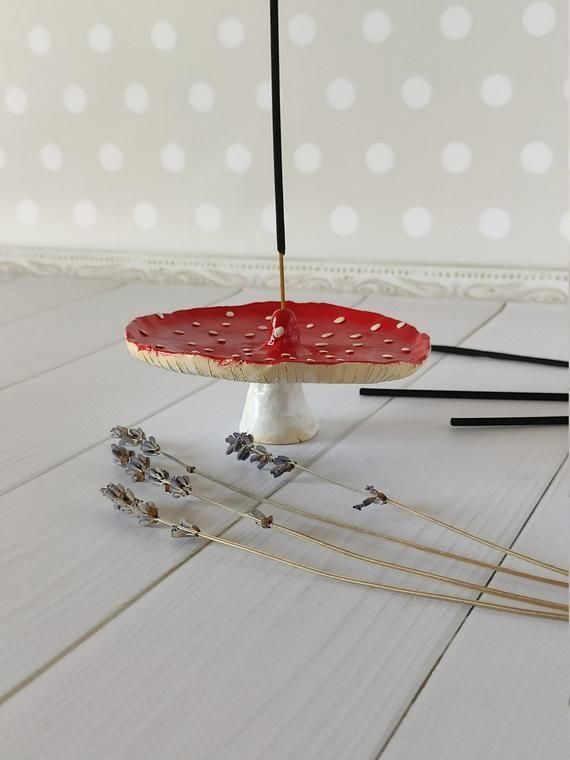 an upside down cake on a white table with some sticks sticking out of the top