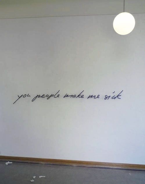 a white wall with writing written on it