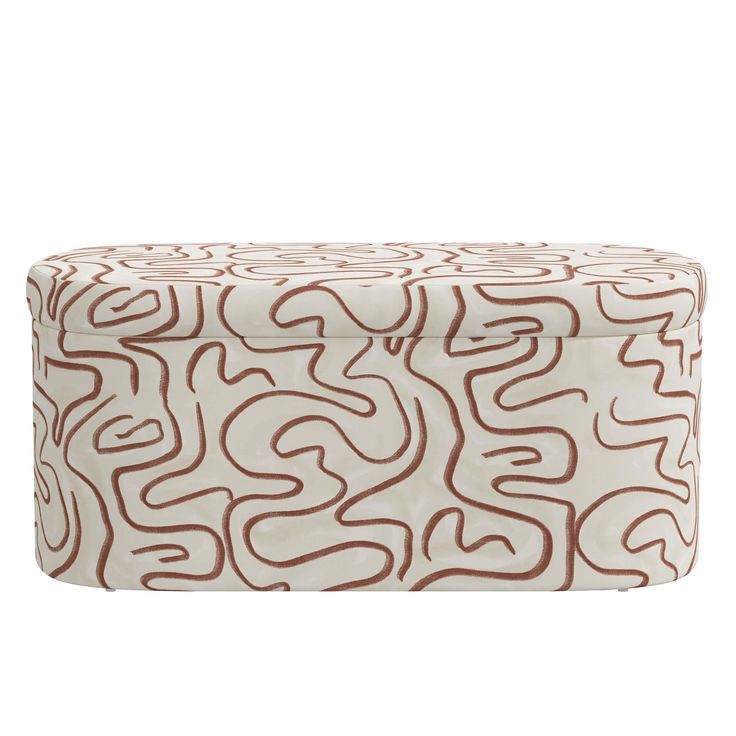 a white and brown ottoman cover with swirls on it's sides, in front of a white background