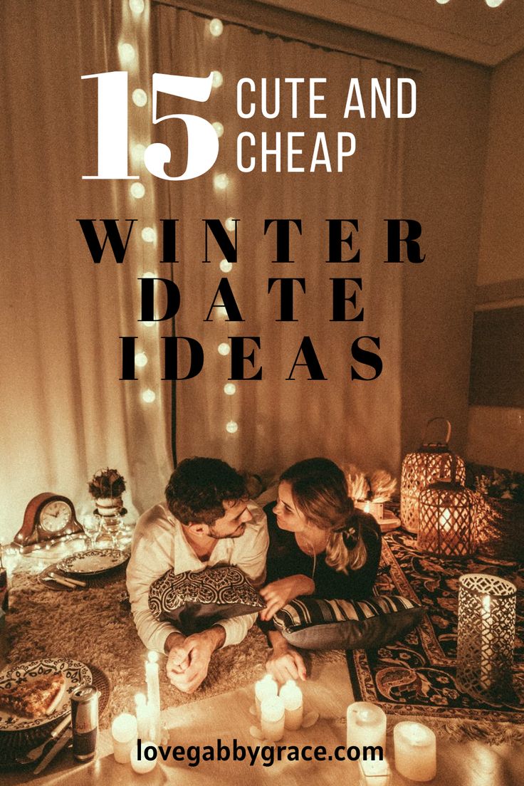 two people sitting on a bed with candles in front of them and the words 15 cute and cheap winter date ideas