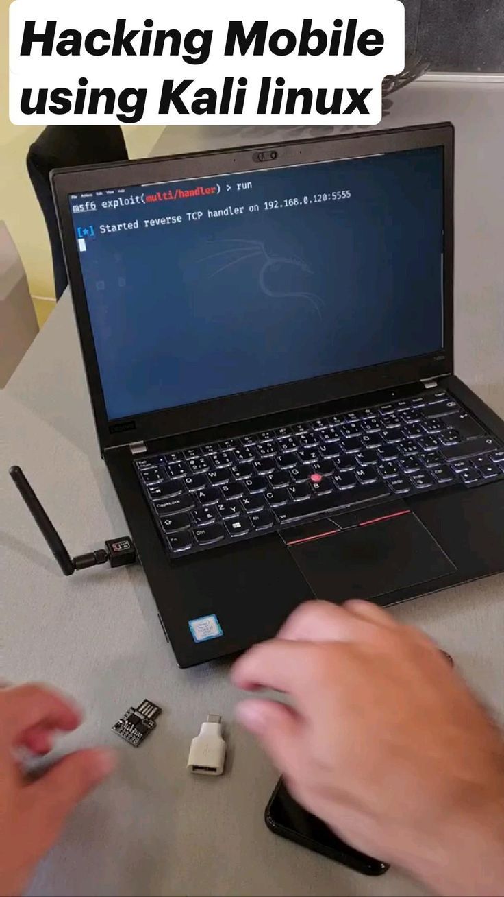 a person is typing on the keyboard of a laptop computer with text reading hacking mobile using kalli linux