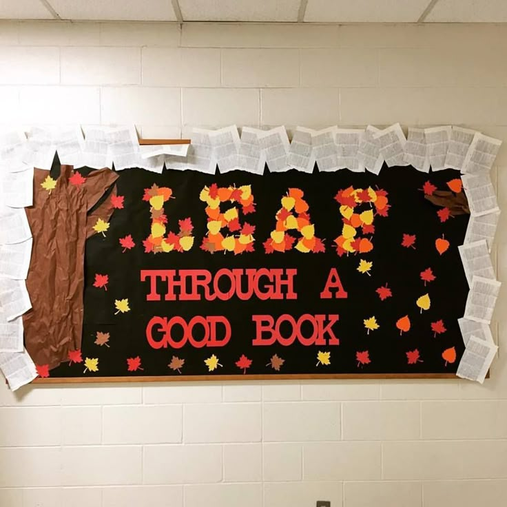 a bulletin board with words and leaves on it that reads lab through a good book