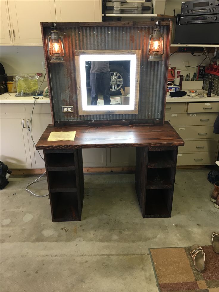 a desk with a mirror on top of it