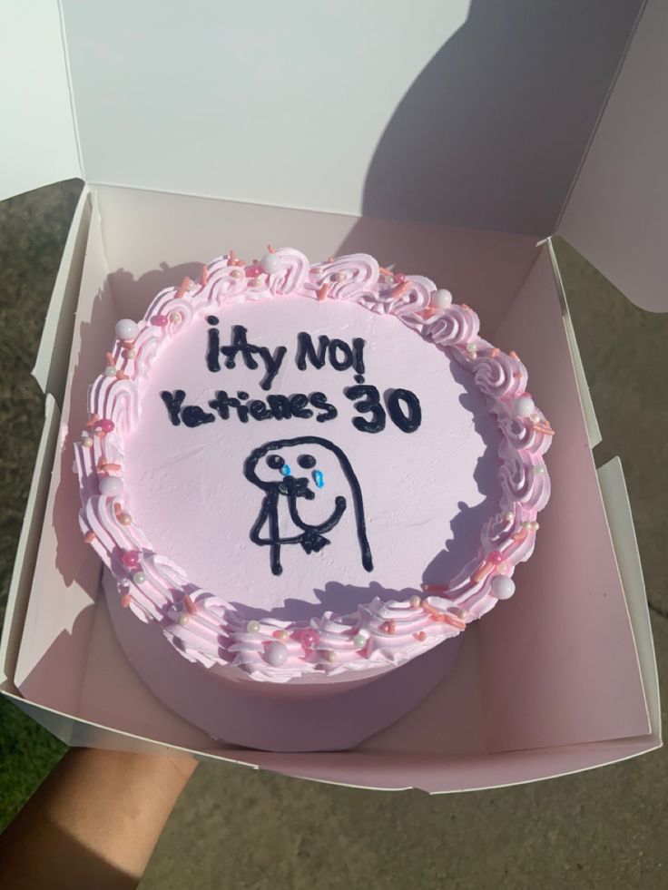 a birthday cake in a box with writing on it