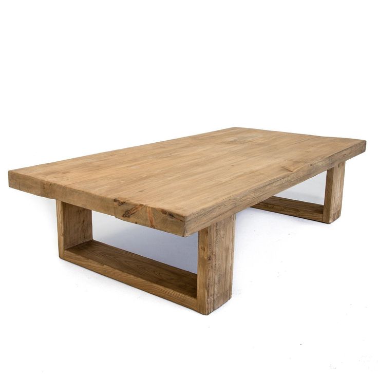 a wooden coffee table with two shelves on each side and one shelf below it, against a white background