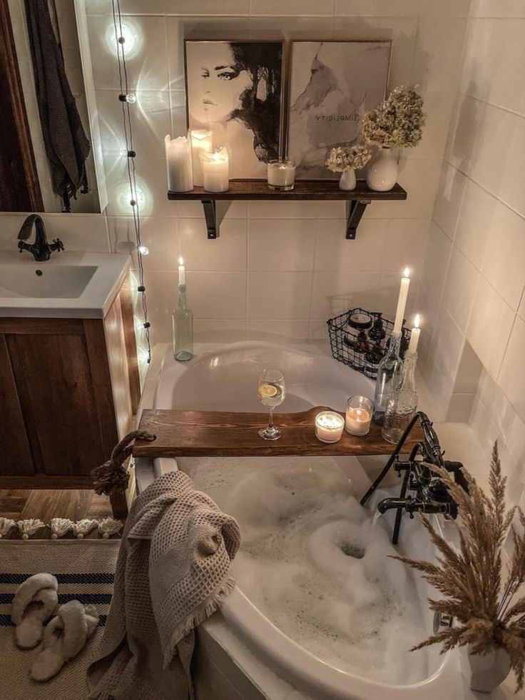 a bathtub filled with water and candles