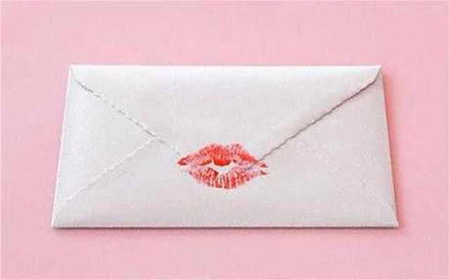 an envelope with lipstick drawn on it